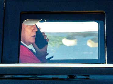 U.S. President Donald Trump talks on the phone as he departs the White House for Trump National Golf Club in Sterling, Virginia, U.S., May 31, 2026. REUTERS/Aaron Schwartz