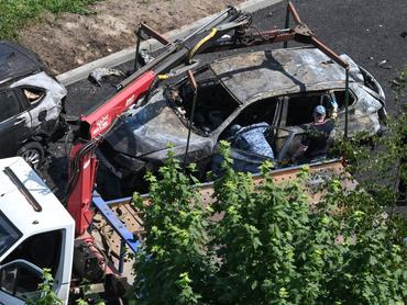 Investigators work at the site of a car bomb, which killed a driver, in Balashikha, outside Moscow, on June 9, 2026. (Photo by Igor IVANKO / AFP)