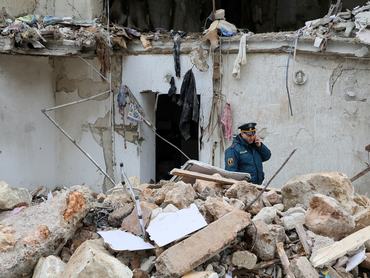 A member of the Russian Emergencies Ministry works at the scene following an overnight explosion at a multi-storey residential building in Sevastopol, Crimea, March 24, 2026. REUTERS/Alexey Pavlishak