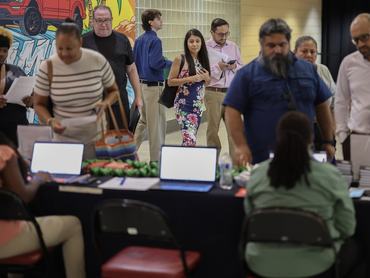 SUNRISE, FLORIDA - SEPTEMBER 25: Job seekers attend the Mega JobNewsUSA South Florida Job Fair held in the Amerant Bank Arena on September 25, 2025 in Sunrise, Florida. Hiring managers and recruiters attended the job fair to recruit workers for some of the positions businesses are trying to fill in Miami, Broward, and Palm Beach Counties. (Photo by Joe Raedle/Getty Images)