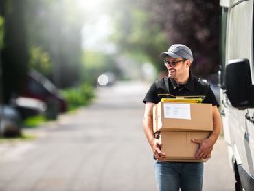 Postman delivery a package to a customer.