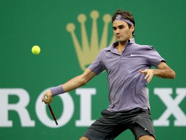 SHANGHAI, CHINA - OCTOBER 17: Roger Federer of Switzerland returns a shot to Andy Murray of Great Britain during the final on day seven of the 2010 Shanghai Rolex Masters at the Shanghai Qi Zhong Tennis Center on October 17, 2010 in Shanghai, China. (Photo by Matthew Stockman/Getty Images)