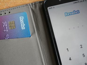 Revolut card next to of Android Revolut mobile app launched on the smartphone is seen in Gdansk, Poland on 9 July 2019 Revolut reached over 400.000 users in Poland this year. The number of Polish clients increased by 100% in 9 months period.Revolut Ltd is a UK financial technology company that offers banking services (Photo by Michal Fludra/NurPhoto via Getty Images)