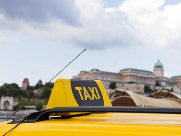 Yellow taxi cabs waiting for a passenger in Budapest