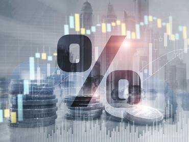Percentage icon on financial stock market background. Double exposure of stack of coins and city.
