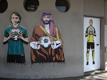 MILAN, ITALY - SEPTEMBER 19: A mural depicting Roberto Mancini, Mohammed bin Salman and Cristiano Ronaldopainted by aleXsandro Palombo outside the San Siro Stadium before the UEFA Champions League match between AC Mila and Newcastle United FC at Stadio Giuseppe Meazza on September 19, 2023 in Milan, Italy. (Photo by Marco Luzzani/Getty Images)