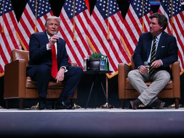 PHOENIX, ARIZONA - OCTOBER 31: Republican presidential nominee, former President Donald Trump sits down for a conversation with Tucker Carlson during his Live Tour at the Desert Diamond Arena on October 31, 2024 in Phoenix, Arizona. With less than a week until Election Day, Trump is campaigning for re-election in New Mexico and the battleground states of Nevada and Arizona on Thursday. (Photo by Chip Somodevilla/Getty Images)