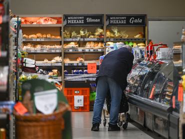 KRAKOW, POLAND - DECEMBER 23: An elderly customer seen inside a supermarket, pushing his trolley, on December 23, 2024 in Krakow, Poland. (Photo by Artur Widak/NurPhoto via Getty Images)