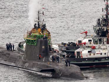 FASLANE, SCOTLAND - MARCH 04: A submarine is manoeuvred at His Majesty's Naval Base Clyde on March 04, 2025 in Faslane, Scotland. His Majesty's Naval Base (HMNB) Clyde, also known as Faslane, hosts the UK's nuclear submarines which are armed with Trident missiles and serve as the UK's nuclear deterrent. Last week Scotland's First Minister John Swinney backed Prime Minister Keir Starmer's plan to increase defense spending to 2.5 per cent of GDP by 2027, but defended his party's opposition to the Trident nuclear missile system, which had an annual running cost estimated at 6% of the defence budget in 2023-24. (Photo by Jeff J Mitchell/Getty Images)
