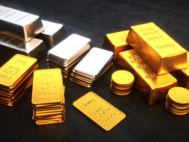 Stacks of precious metal ingots and coins