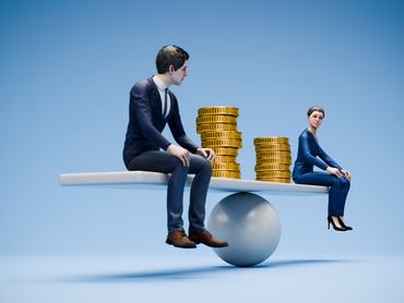 Equal pay concept: A man and a woman figurine in business attire sitting on a scale / seesaw with a different number of golden coins besides them. Selective focus on the woman
