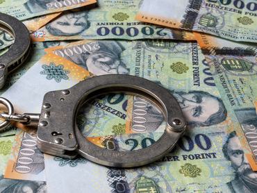Hungarian 20.000 Ft banknotes and handcuffs