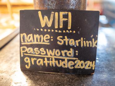 Wifi information is handwritten on a blackboard, including the Wifi network name Starlink, in Duncans Mills, California, June 8, 2025. (Photo by Smith Collection/Gado/Getty Images)