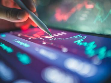 collaborative business with AI scenario showing active use of financial apps and hybrid devices for data monitoring, portfolio evaluation, and stock market planning. great for multi-platform finance, fintech workflow, and investor tools.