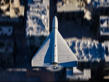 Top shot of Shahed 136 kamikaze military UAV (drone) flying with high speed over war-torn city towards its target. Destroyed buildings visible beneath it capturing the horrors of war.