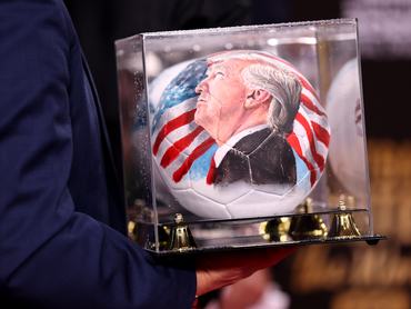 WASHINGTON, DC - DECEMBER 05: U.S. President Donald Trump reacts on stage during the FIFA World Cup 2026 Official Draw at John F. Kennedy Center for the Performing Arts on December 05, 2025 in Washington, DC. (Photo by Scott Taetsch - FIFA/FIFA via Getty Images)