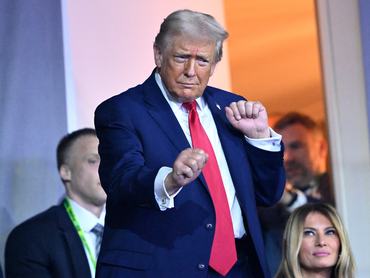 WASHINGTON, DC - DECEMBER 05: U.S. President Donald Trump dances to the final performance of the Village People during the FIFA World Cup 2026 Official Draw at John F. Kennedy Center for the Performing Arts on December 05, 2025 in Washington, DC. (Photo by Mandel NGAN - Pool/Getty Images)