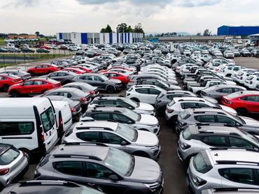 Drone shot of cars for sale outdoors at the dealership