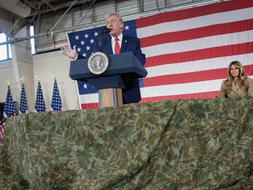 FORT BRAGG, NORTH CAROLINA - FEBRUARY 13: U.S. President Donald Trump and first lady Melania Trump visit the Fort Bragg U.S. Army base on February 13, 2026 in Fort Bragg, North Carolina. Trump visited the base to honor special forces involved in the military operation in Venezuela in early 2026. (Photo by Nathan Howard/Getty Images)