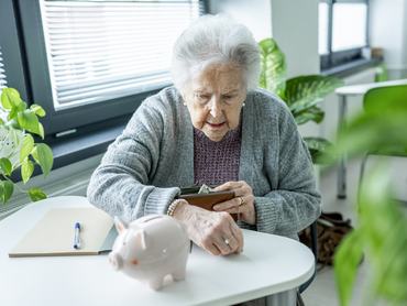 Senior woman planning finances and savings for retirement. Financial literacy
