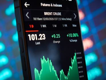 Oil prices are seen displayed on a mobile device in this illustration photo taken in Warsaw, Poland on 12 March, 2026. Oil prices climbed back above $100 a barrel and stock markets fell after 3 more vessels were hit in the Gulf. Iran's new supreme leader vowed to keep blocking the key Strait of Hormuz shipping route. Brent crude rose by more than 9% on Thursday to $101.59 before easing slightly to $99.44. (Photo by Jaap Arriens/NurPhoto via Getty Images)