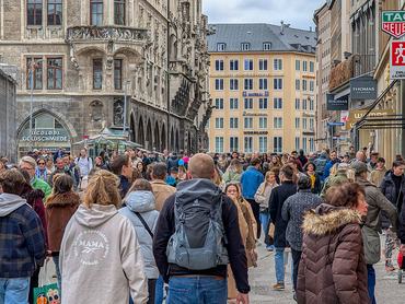 Crowds of pedestrians and shoppers walk along Weinstrasse toward Marienplatz in Munich, Bavaria, Germany, on March 14, 2026. The scene depicts busy retail activity and consumer spending in the historic city center. (Photo by Michael Nguyen/NurPhoto via Getty Images)