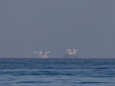RAS AL KHAIMAH, UNITED ARAB EMIRATES - MARCH 22: Commercial vessels in the Gulf, near the Strait of Hormuz on March 22, 2026 in northern Ras al Khaimah, United Arab Emirates. In a statement yesterday, the UAE and nearly two dozen other countries issued a joint statement condemning Iran's "attacks by Iran on unarmed commercial vessels in the Gulf, attacks on civilian infrastructure including oil and gas installations, and the de facto closure of the Strait of Hormuz by Iranian forces." Maritime traffic through the strait, which conveys about 20% of the world's oil and gas, has mostly come to a halt after the joint U.S.-Israeli war with Iran that began on February 28. (Photo by Getty Images/Getty Images)
