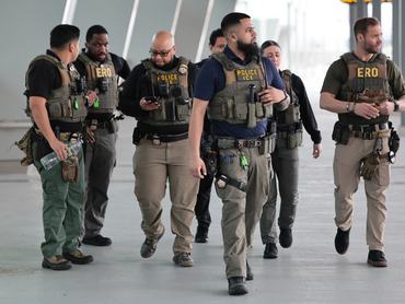 NEW YORK, NEW YORK - MARCH 23:  Immigration and Customs Enforcement (ICE) agents patrol Terminal B at LaGuardia Airport on March 23, 2026 in New York City. The travel disruptions continue as hundreds of TSA agents quit or work without pay during a partial government shutdown. U.S. President Donald Trump said ICE agents will be deployed to U.S. airports on Monday, with border czar Tom Homan in charge of the effort. (Photo by Michael M. Santiago/Getty Images)