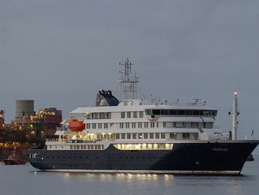 TENERIFE, SPAIN - MAY 10: The MV Hondius arrives in the Granadilla Port on May 10, 2026 in Tenerife, part of the Canary Islands, Spain. The cruise ship MV Hondius, which had three passengers die from Hantavirus last month and eight more reported cases, arrived on Sunday May 10 in Tenerife, where the remaining passengers will be repatriated to their respective countries. At a press conference this week, representatives of the World Health Organization (WHO) emphasized the outbreak of this rare virus did not constitute a pandemic, but it has stirred anxieties in the Canary Islands and elsewhere. (Photo by Chris McGrath/Getty Images)