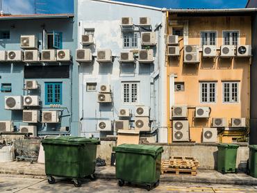 Air conditioners on the wall on the back street. Urban design solutions.