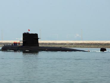 QINGDAO, CHINA - APRIL 22: A Chinese navy submarine leaves Qingdao Port on April 22, 2009 in Qingdao of Shandong Province, China. China's navy is set to hold a huge maritime ceremony to mark its 60 years of the Chinese navy and has invited ships and top officials from dozens of countries to attend.  (Photo by Guang Niu/Pool/Getty Images)