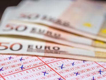 Banknotes and lottery ticket as a symbol of fast money