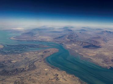 FILE PHOTO: An aerial view of the island of Qeshm, separated from the Iranian mainland by the Clarence Strait, December 10, 2023. REUTERS/Stringer/File Photo REFILE - CORRECTING INFORMATION TO REMOVE STRAIT OF HORMUZ