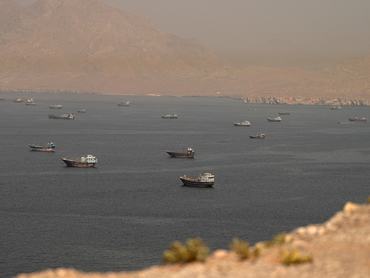 FILE PHOTO: Vessels at the Strait of Hormuz, as seen from Musandam, Oman, June 18, 2026. REUTERS/Stringer/File Photo