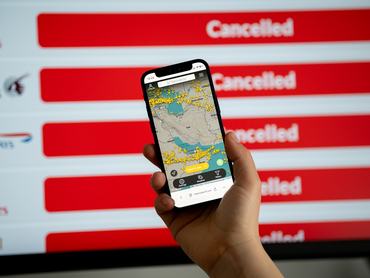 The Flightradar24 app displays on a mobile phone showing empty skies due to closed Iranian airspace, and a website with flight cancellations appears on a computer screen in Krakow, Poland, on March 3, 2026. Civil aviation comes to a halt across the region as Iran extends its airspace closure (Tehran FIR) following military strikes by the United States and Israel. The live tracking map reveals a lack of commercial traffic over Iran, Iraq, and Israel, forcing international carriers to divert thousands of flights. This causes disruption of global air travel and the geopolitical isolation of Iranian airspace. (Photo by Marcin Golba/NurPhoto via Getty Images)