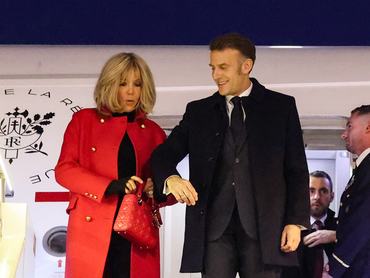 BEIJING, CHINA - DECEMBER 3: France's President Emmanuel Macron and his wife Brigitte Macron disembark from their plane upon their arrival at the Capital International Airport in Beijing on December 3, 2025 in Beijing, China. Macron is on an official visit to China that comes on the heels of continuing tension over trade between China and the EU. (Photo by Ludovic Marin-Pool/Getty Images)