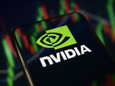 The Nvidia logo is displayed on a smartphone screen placed on a reflective surface onto which a stock chart is projected, in Creteil, France, on May 20, 2026. The global technology leader is scheduled to release its financial results for the first quarter of fiscal year 2027. (Photo by Samuel Boivin/NurPhoto via Getty Images)