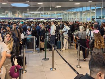 Queues of passengers at Lisbon Humberto Delgado Airport Arrivals waiting for immigration border control processing for up to 3 hours in June 2025
