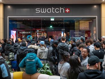 CARDIFF, WALES - MAY 16: Crowds gather outside the Swatch store in St. Davids Shopping centre on May 16, 2026 in Cardiff, Wales. Swatch are today releasing the Swatch x Audemars Piguet Royal Pop pocket watch. People have have been queuing since midday on April 15. (Photo by Matthew Horwood/Getty Images)