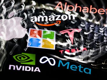 A laptop keyboard and Alphabet, Apple, Amazon, Microsoft, Tesla, Nvidia and Meta logo displayed on a phone screen are seen in this multiple exposure illustration photo taken in Krakow, Poland on February 19, 2026. (Photo by Jakub Porzycki/NurPhoto via Getty Images)