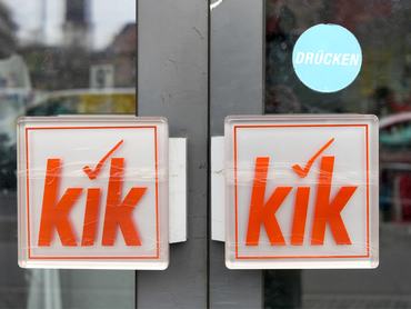 24 March 2026, Berlin: The logo of textile and household goods discounter Kik can be seen at the entrance to a store. Kik is closing hundreds of stores this year. This was announced by the company's managing director in an interview with the German Press Agency. Kik did not provide a list of the stores that are to close. Photo: Soeren Stache/dpa (Photo by Soeren Stache/picture alliance via Getty Images)