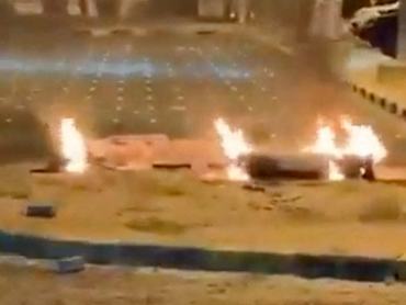 Debris burns on the ground in a parking lot following reports of missile and drone attacks, in Sabah Al Nasser, Kuwait June 3, 2026, in this screengrab obtained from a social media video . SOCIAL MEDIA/via REUTERS  THIS IMAGE HAS BEEN SUPPLIED BY A THIRD PARTY. NO RESALES. NO ARCHIVES. NEWS USE ONLY.  VERIFICATION:  - Parking lot layout, mosque, building and signboard matched archive and satellite imagery - Coordinates 29.270079689938402, 47.88228503934909 - Date confirmed by Kuwait army statement released on Wednesday (June 3) saying they were responding to missiles and drone threats - No earlier versions of the footage were found posted online before Wednesday